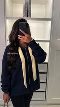 Gilet en maille à capuche